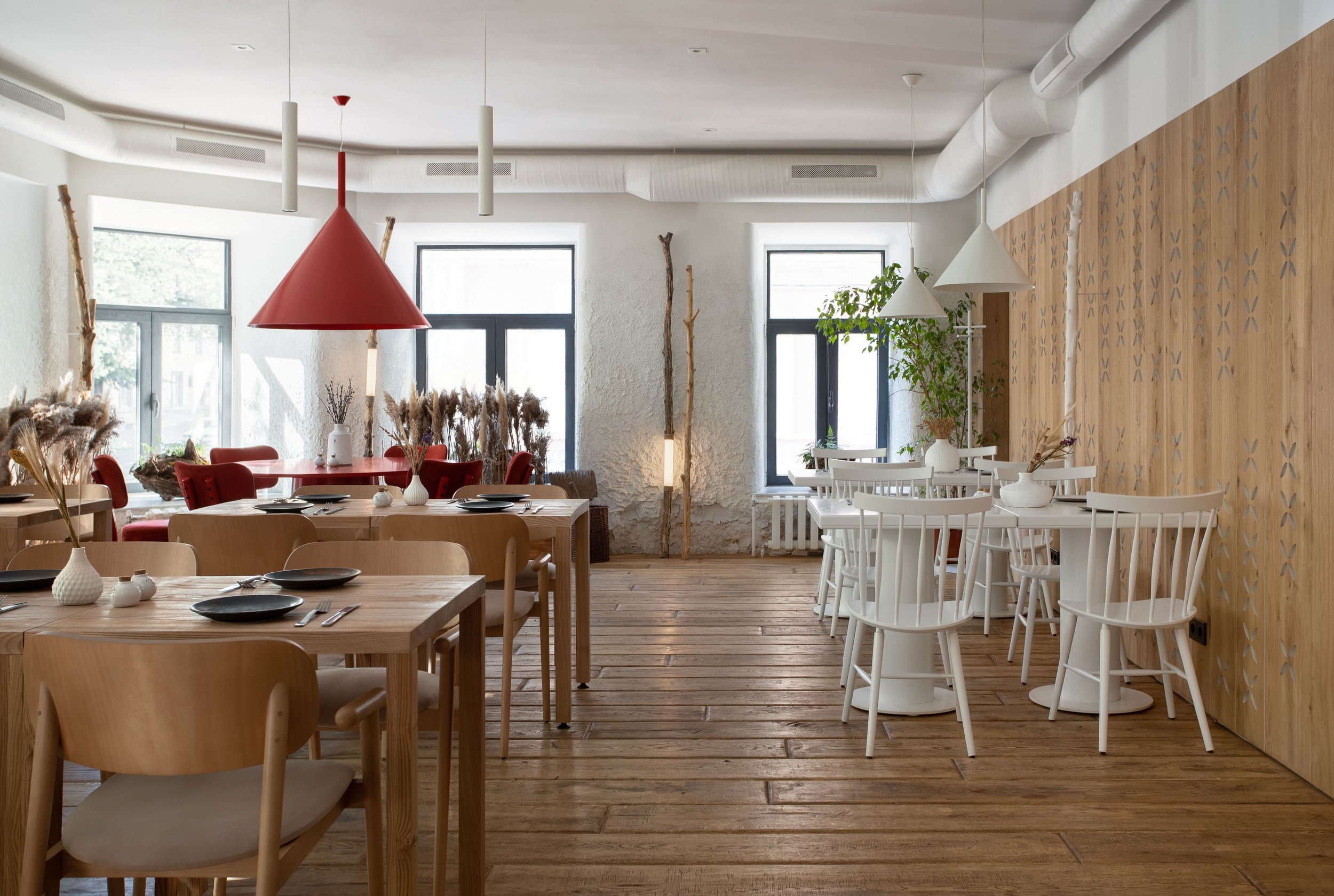 Bright hall with a modern minimalist design of the restaurant “100 years ago forward” in Kyiv