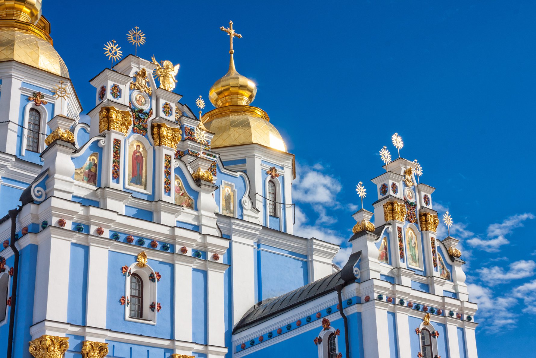 St. Michael's Golden-Domed Monastery in Kyiv - historic cathedral with golden domes, 48-meter bell tower, and colorful frescoes.