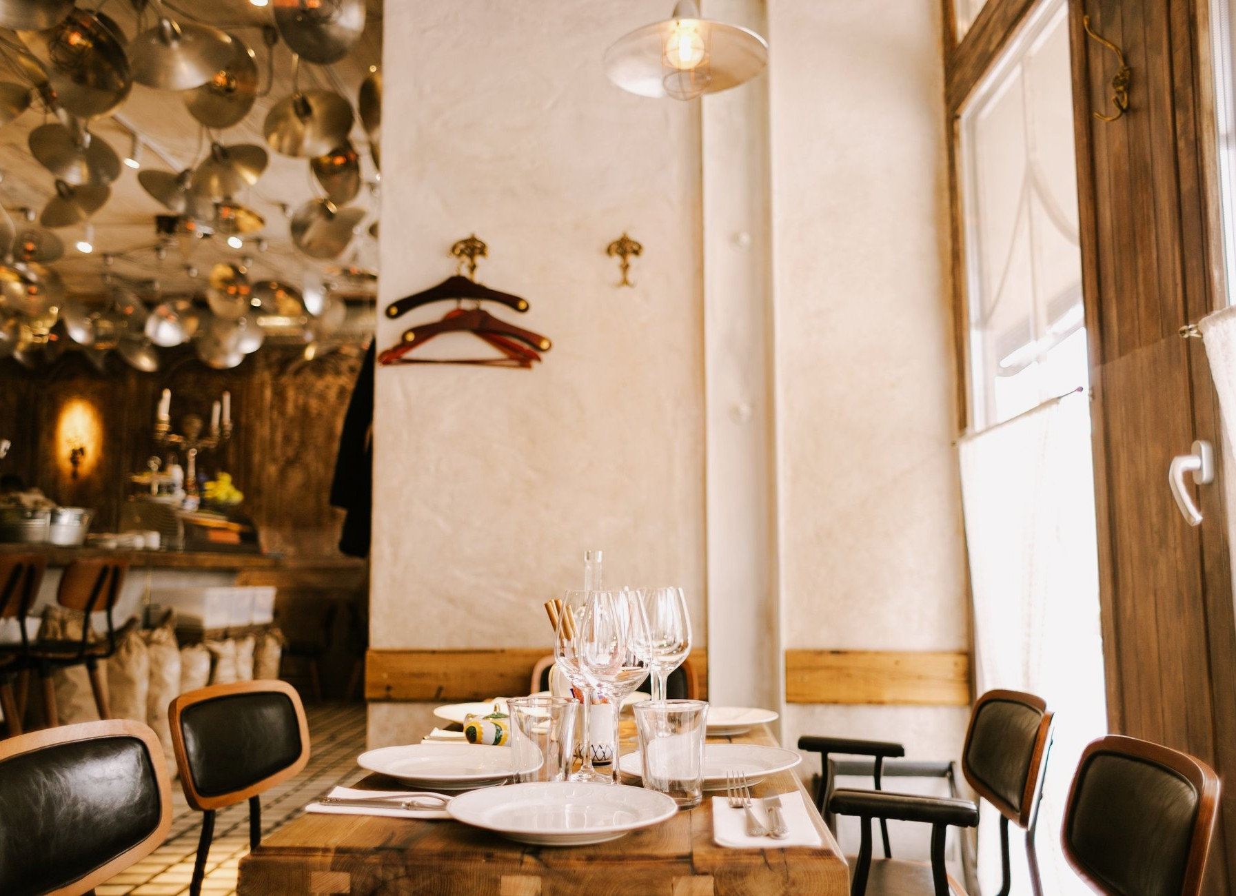 Fish Pussycat - spacious dining area with modern lighting and casual wooden furniture