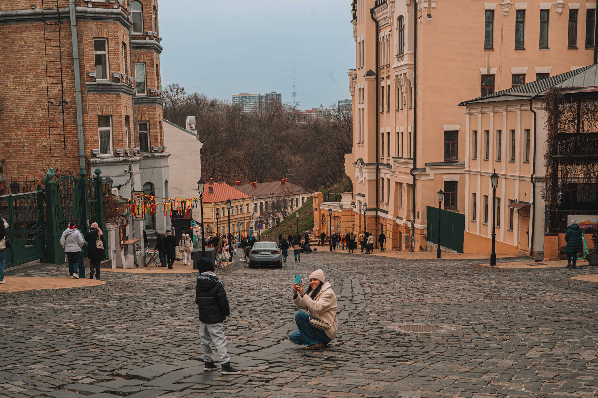 Andriyivskyi Descent - castle of Richard and people on the cobbled street
