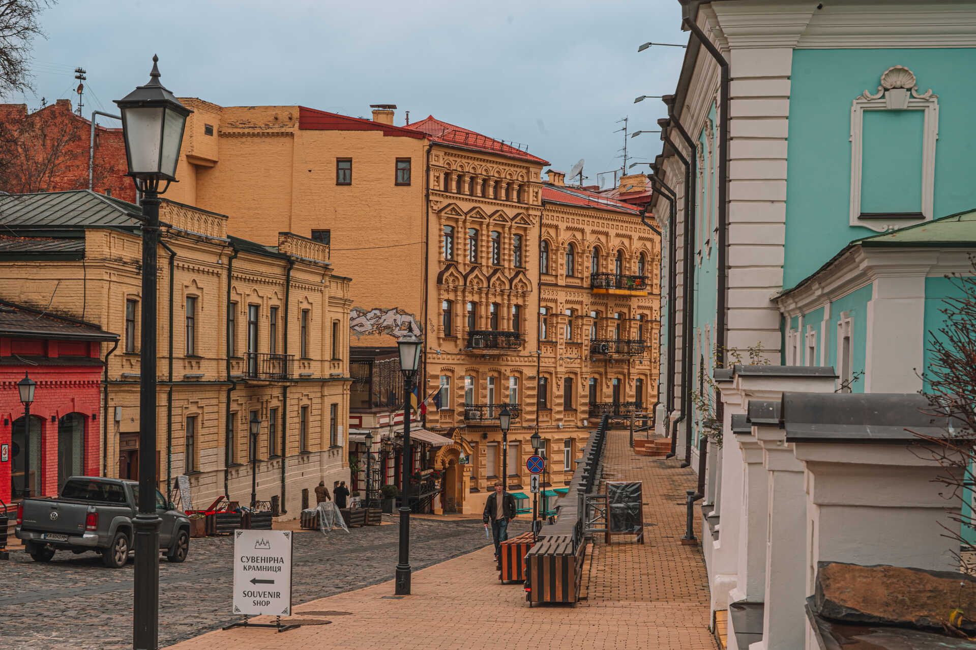 Andriyivskyi Descent - paved street with yellow historic buildings and lanterns