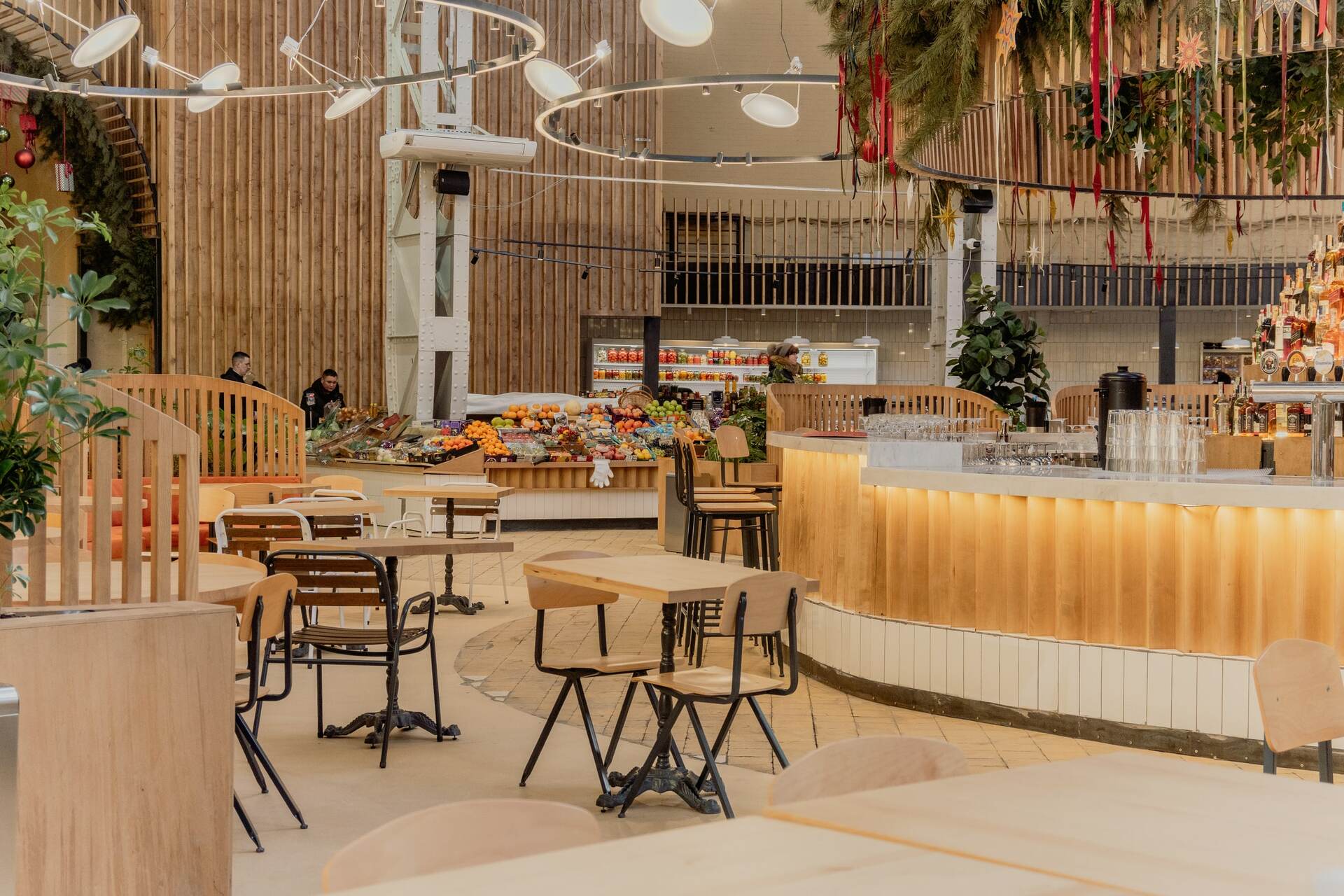 Empty tables, counters and a bar in the food hall of the Bessarabsky Market in Kyiv