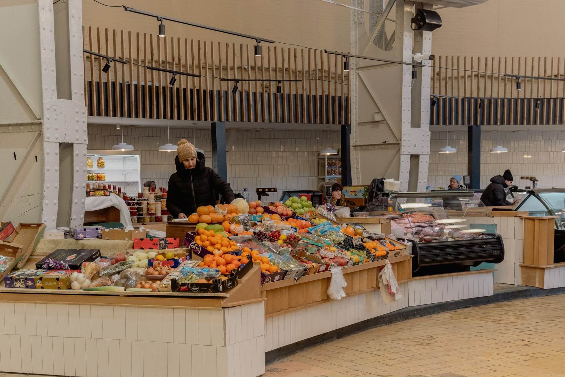 A vendor selling fresh fruit at a Bessarabskyi Market stall in Kyiv