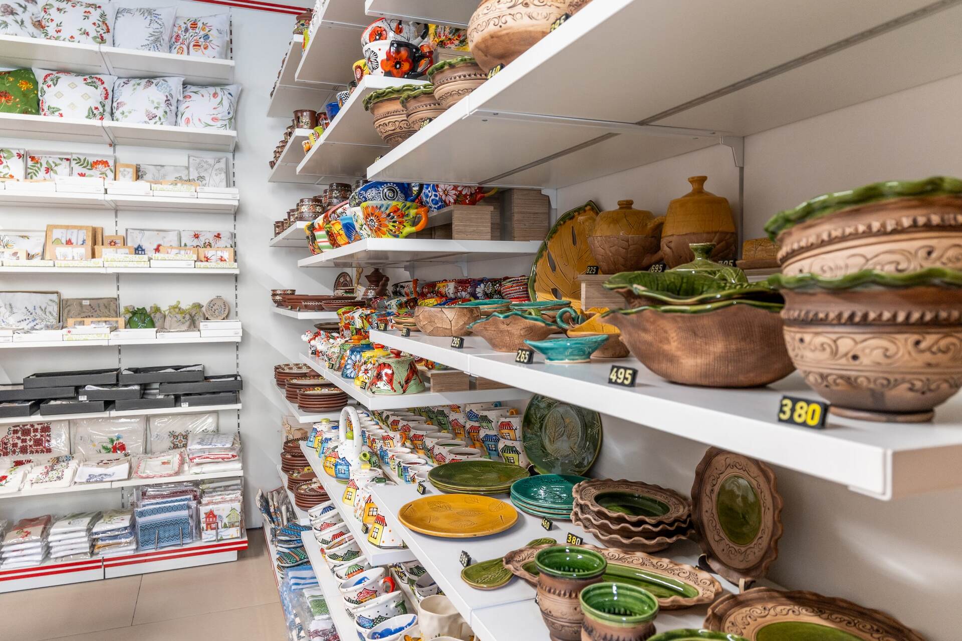 Shelves filled with traditional Ukrainian ceramic pottery at Folkmart store in Kyiv