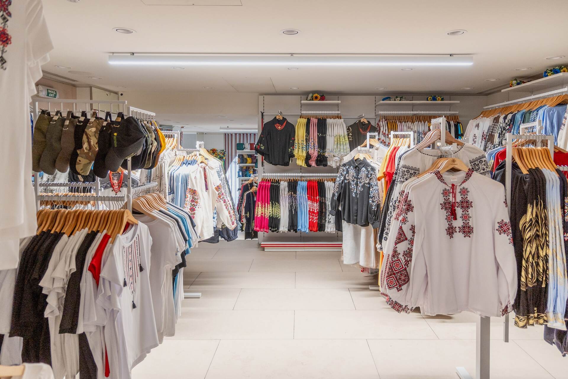 The clothing section featuring racks of traditional Ukrainian vyshyvankas at Folkmart store in Kyiv