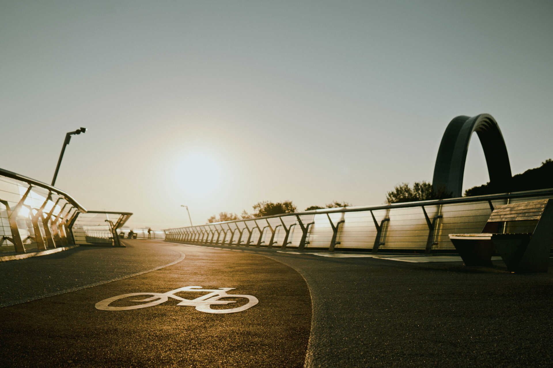 Pedestrian and cycle path on the glass bridge in Kyiv with city view