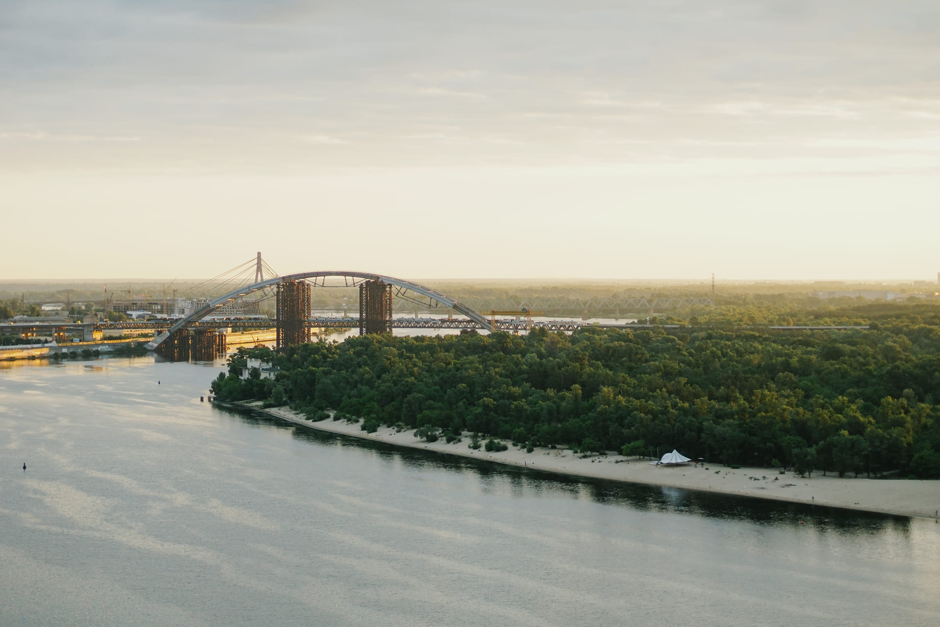 View of the Podilsko-Voskresenskyi Bridge and the Dnipro River in Kyiv from the glass bridge