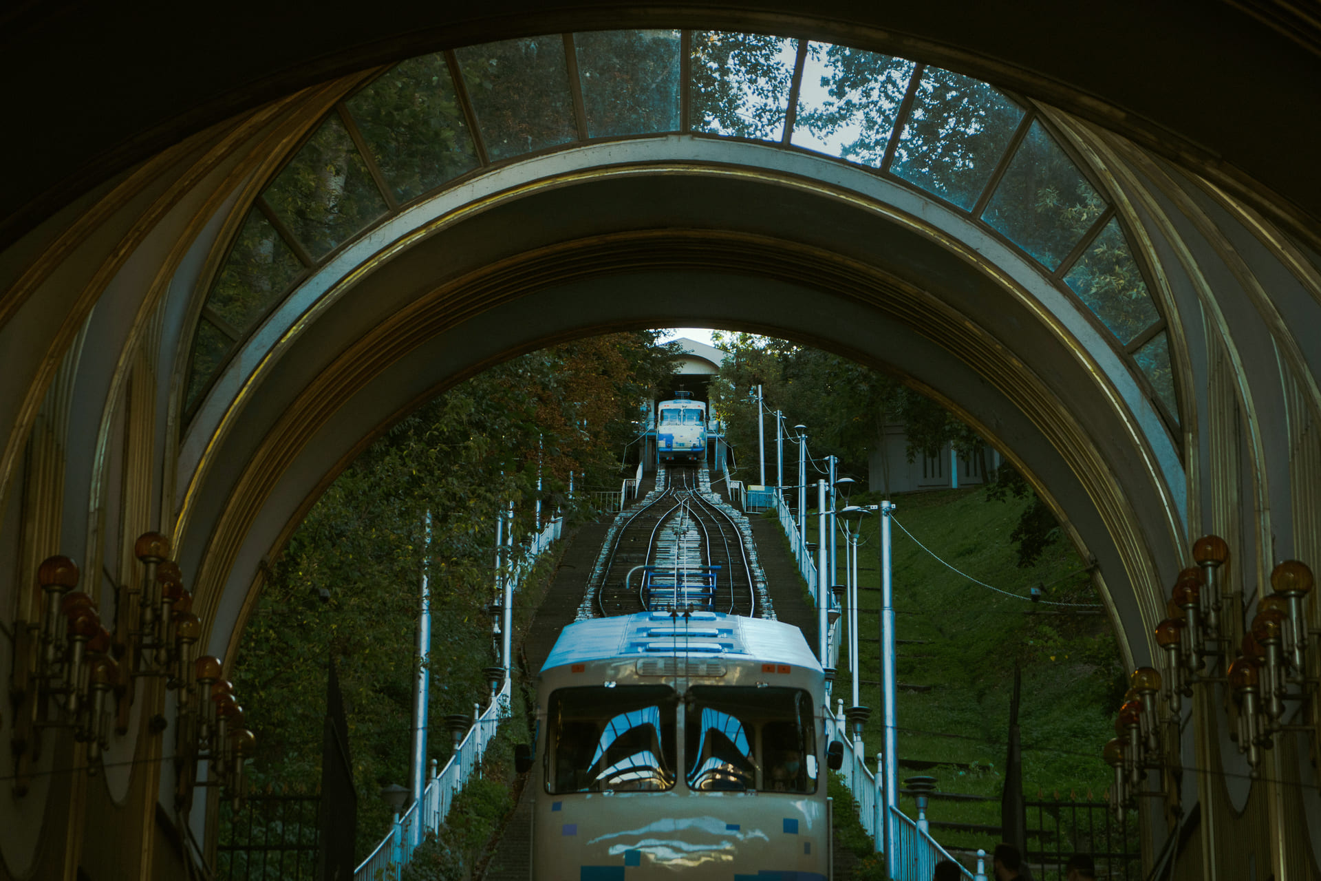 Kyiv Funicular - view through the station arch of a blue carriage ascending