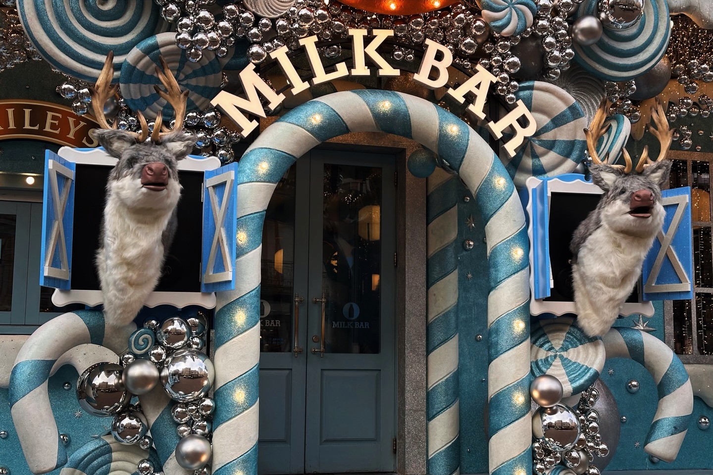 Milk Bar in Kyiv – winter holiday entrance decorated with candy canes and lights