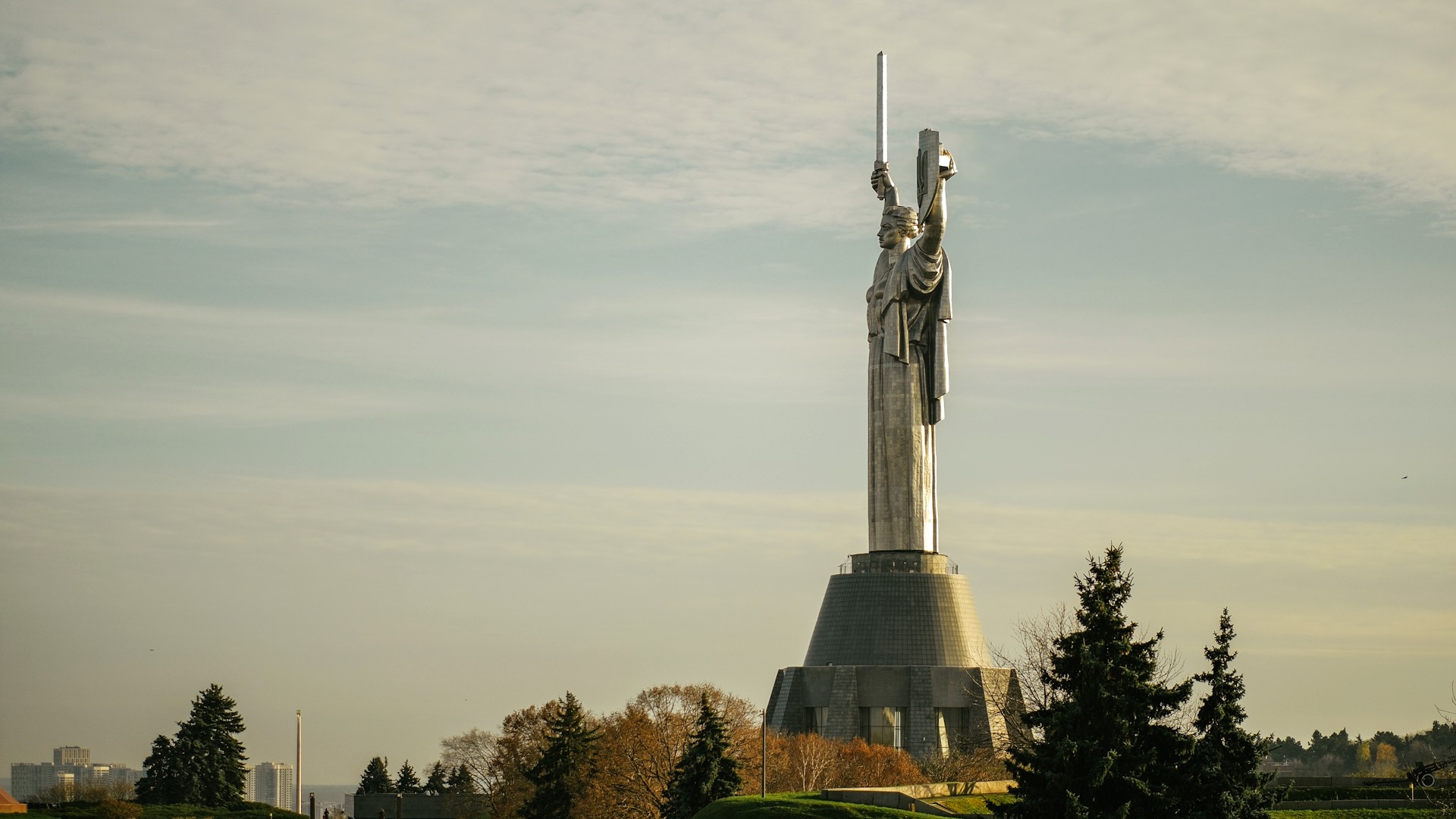 Motherland Monument in Kyiv - full side view of the statue with sword and shield