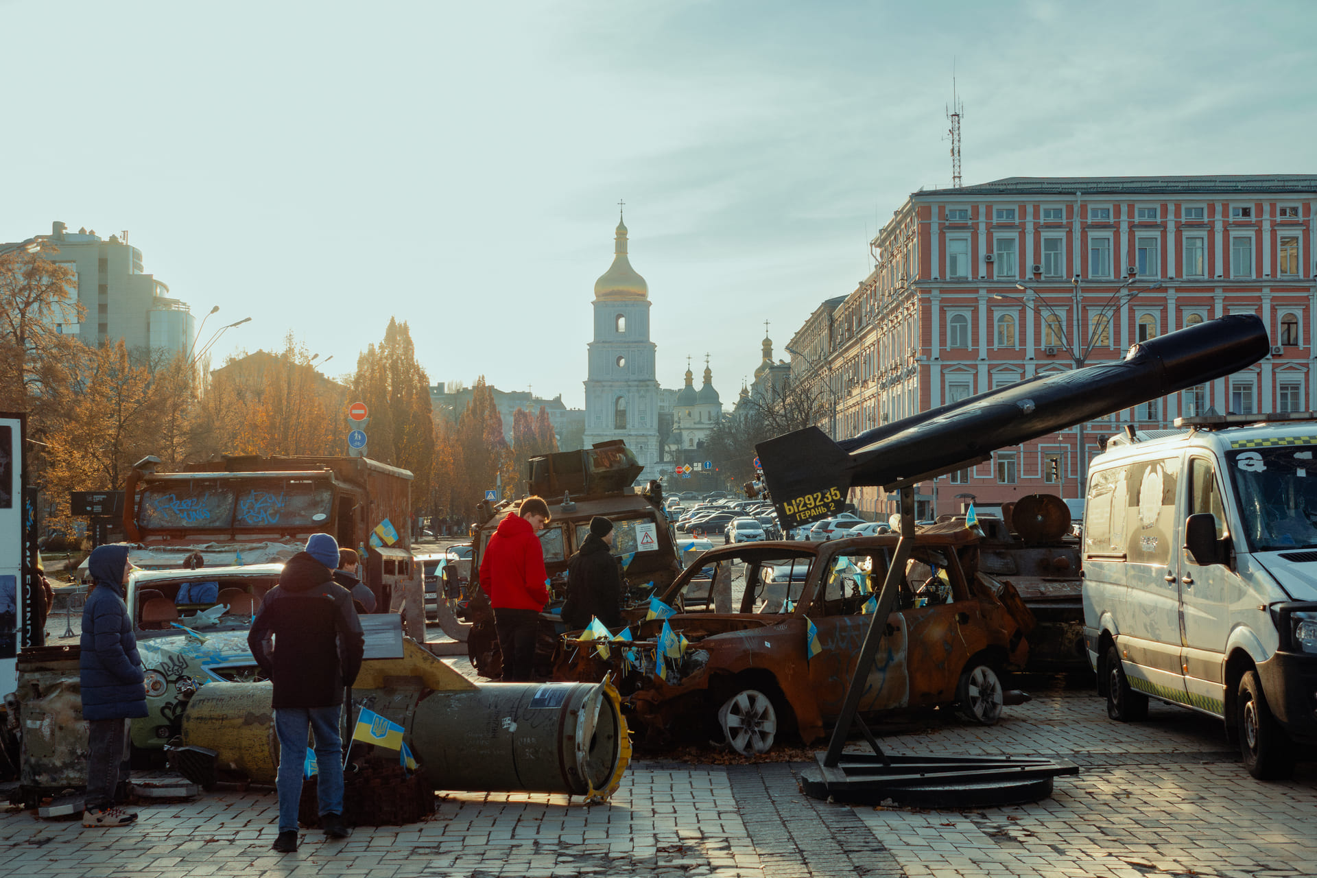 St. Michael's Cathedral in Kyiv - destroyed cars and missile part on square