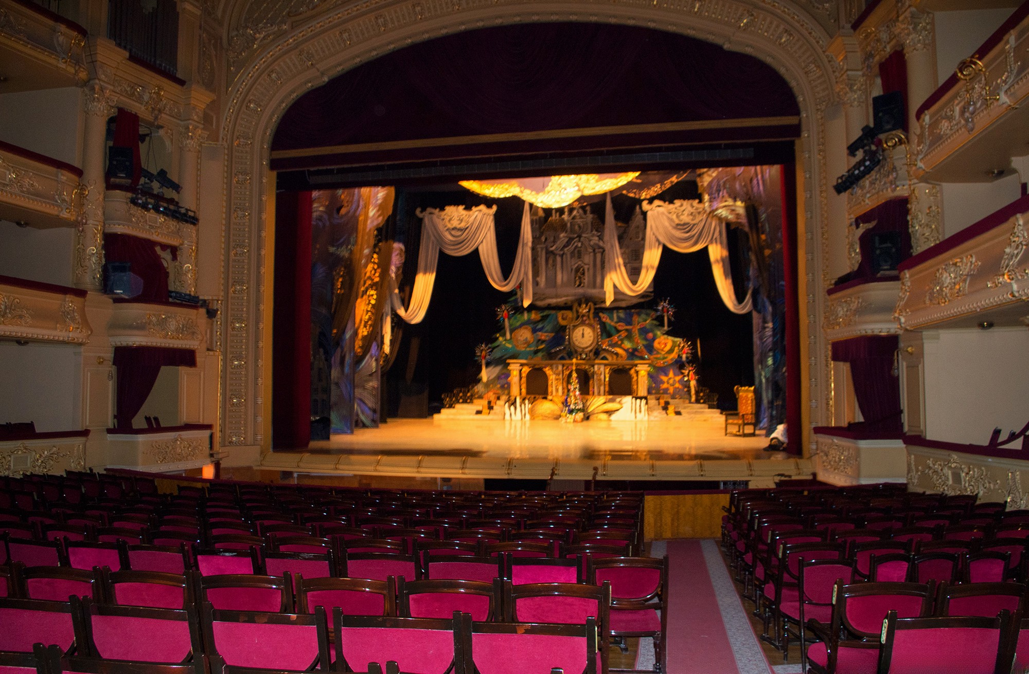 National Opera of Ukraine in Kyiv - grand stage view framed by red velvet curtains featuring a fairytale castle set design