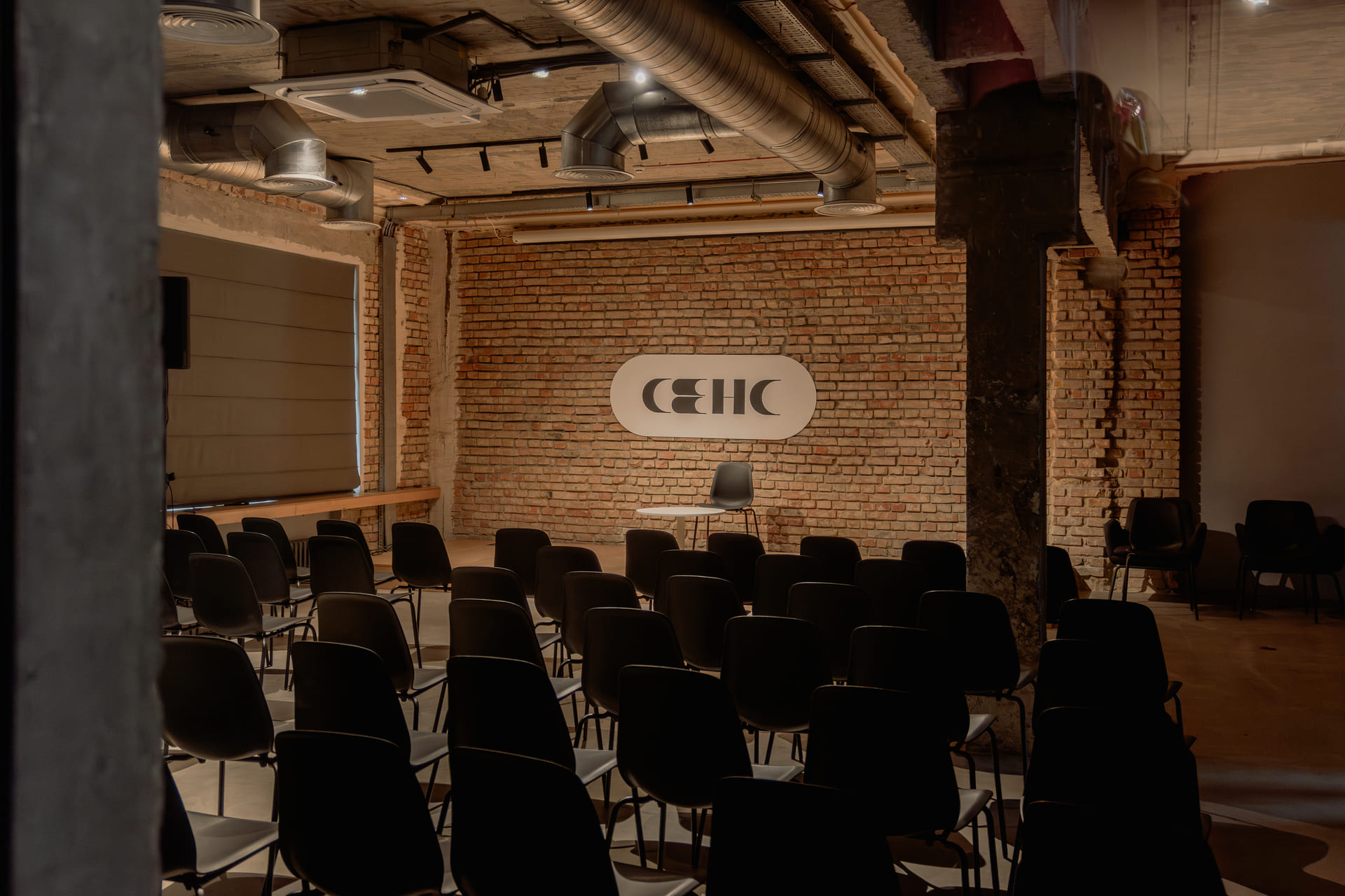 Empty event hall with rows of chairs at Sens bookstore in Kyiv