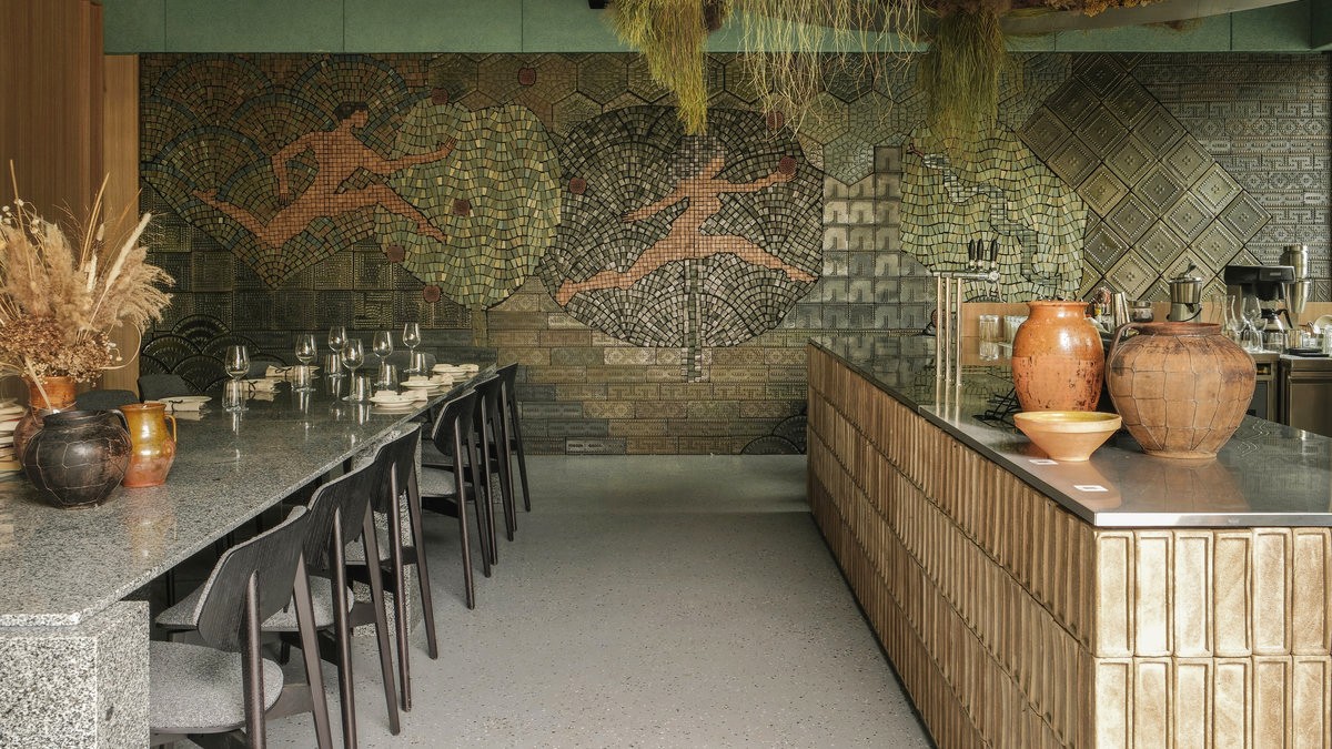 Strichka restaurant in Kyiv - dining hall with a large sports mosaic wall