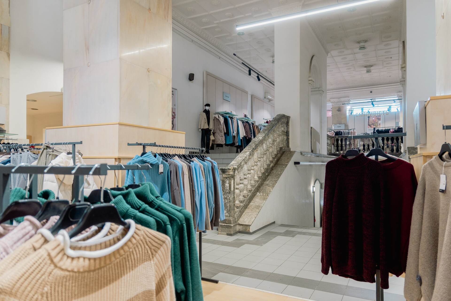 Racks with colorful knitted sweaters in the Vsi Svoi store in Kyiv