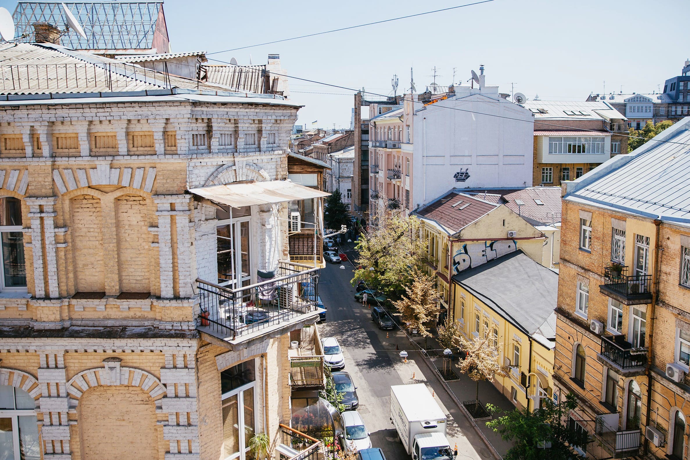 Vulytsia Reitarska in Kyiv - sunny view from a balcony overlooking a cozy street and old courtyards