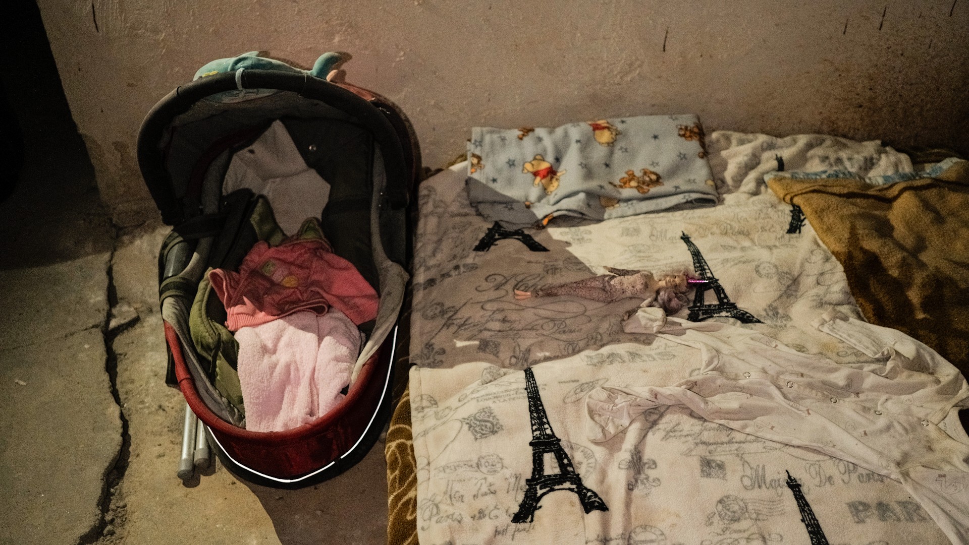 War Museum in Kyiv - basement shelter living space with a baby stroller