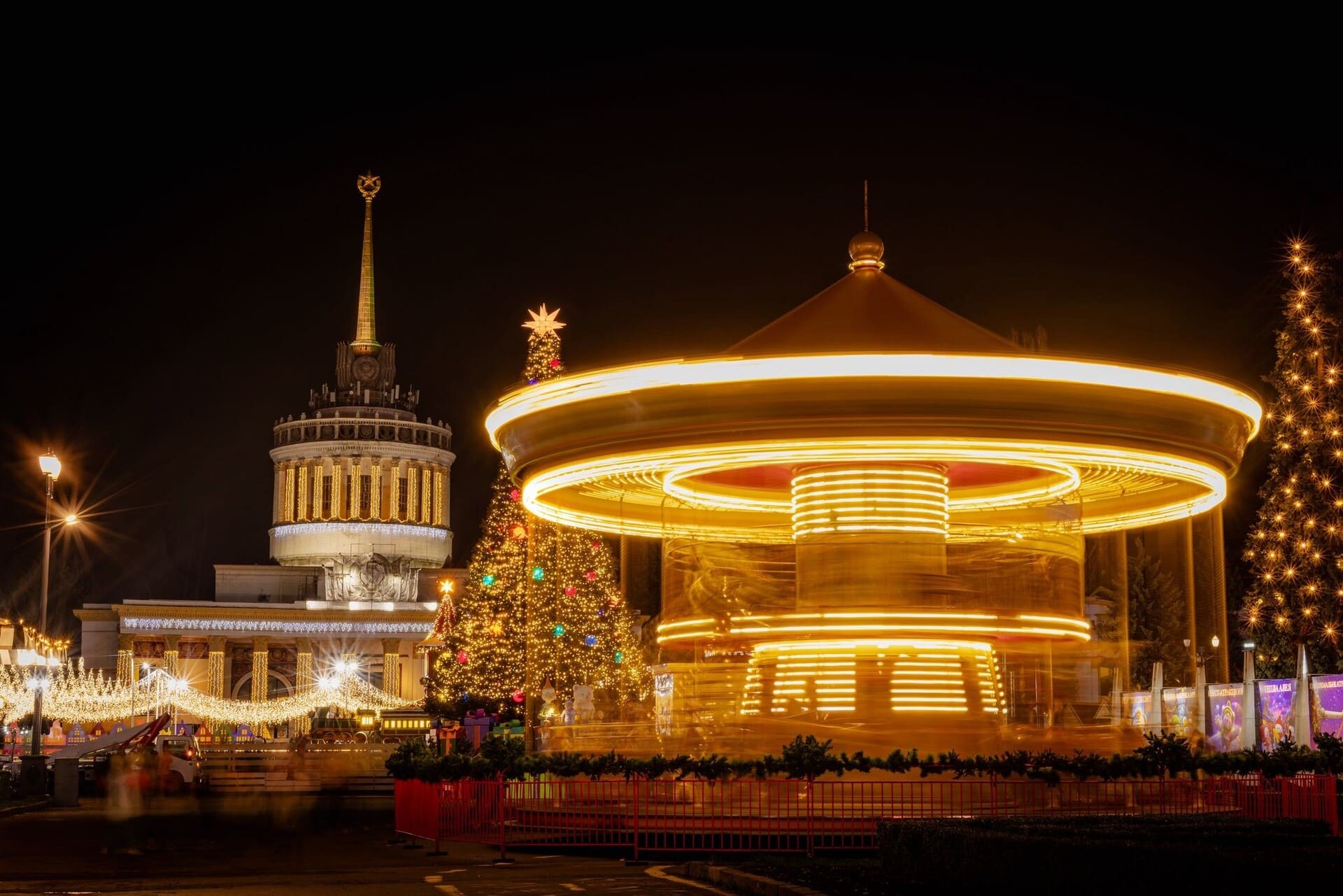 Zymova Kraina winter park with illuminated attractions at VDNG in Kyiv