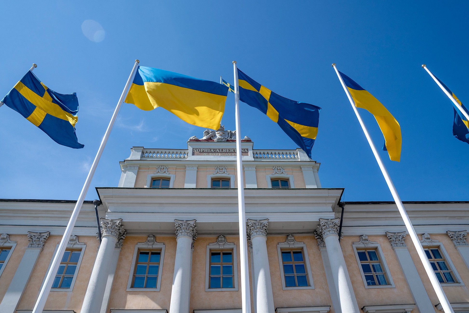Foreign embassy building with Ukrainian and EU flags in Kyiv