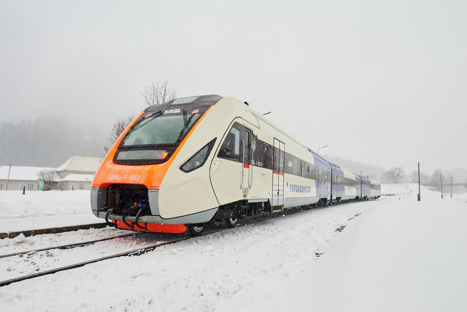 Ukrzaliznytsia passenger train operating during winter in Kyiv