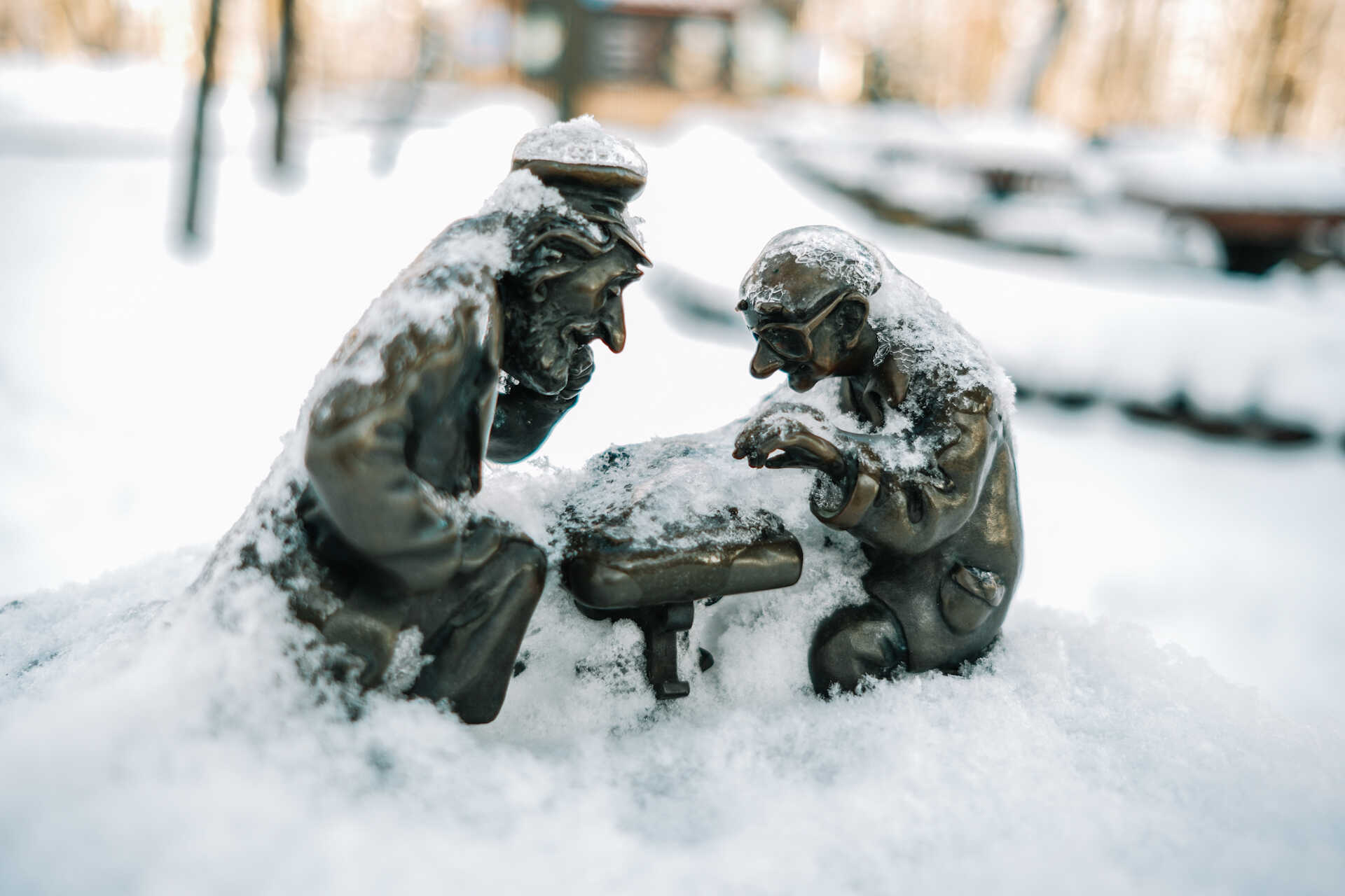 Small bronze sculpture of two men playing chess in Kyiv