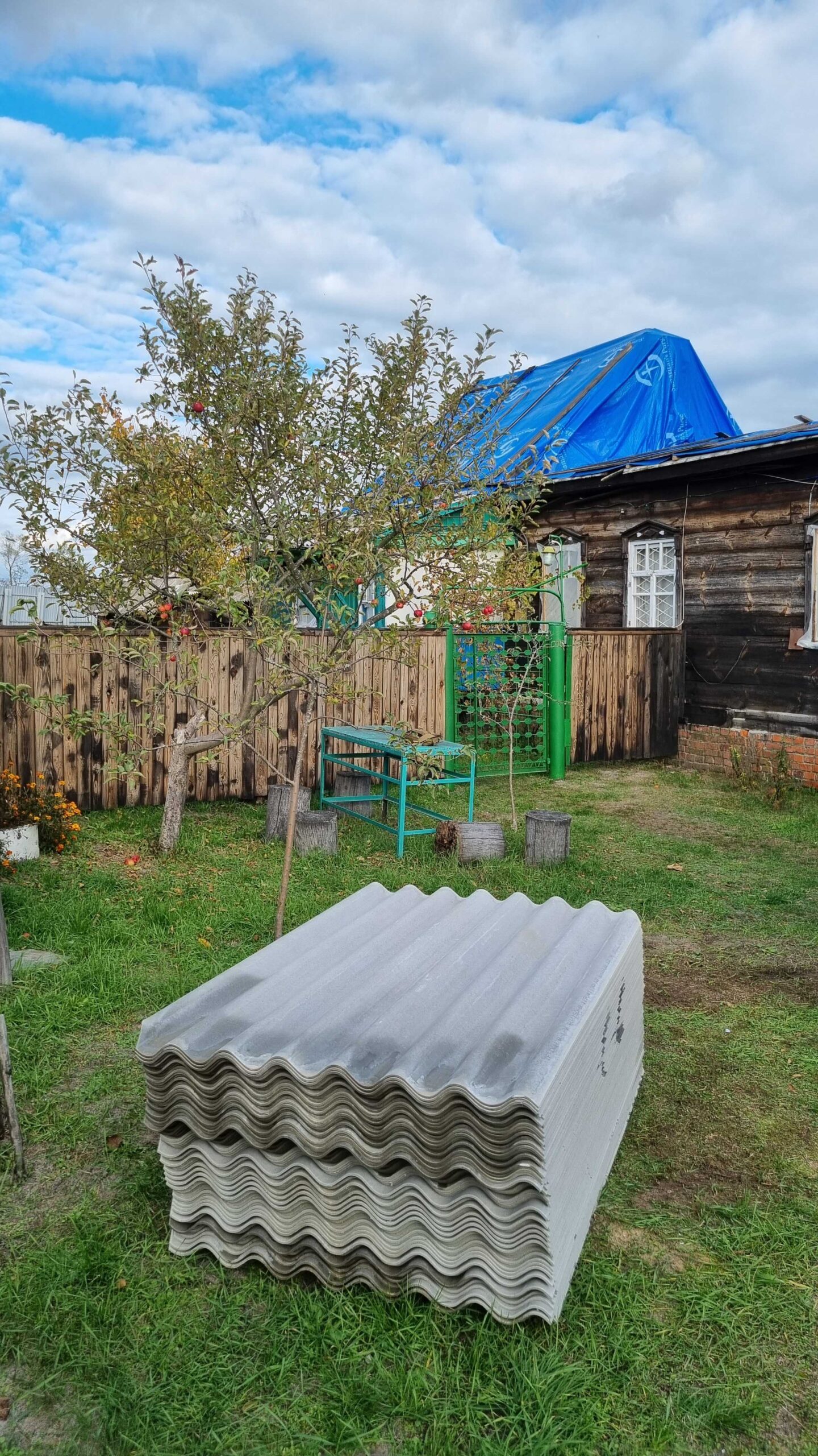 Volunteers repairing damaged house roof after Russian invasion in Kyiv