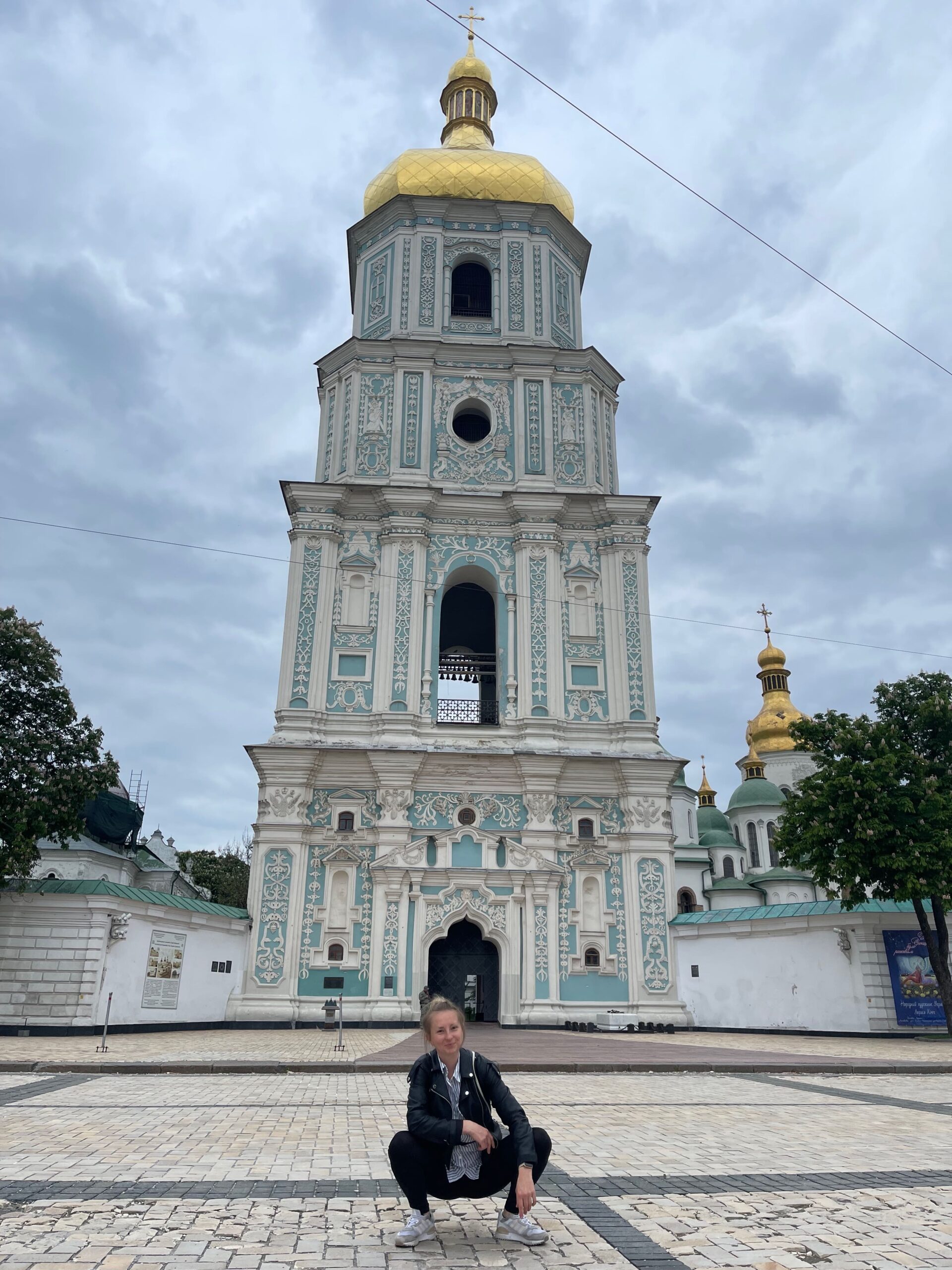 Visitor at the bell tower of St. Sophia during travel and life in Kyiv