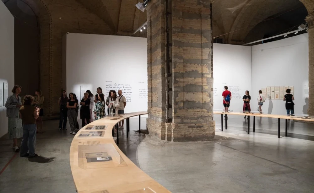 Exhibition hall of Mystetskyi Arsenal with arches and visitors