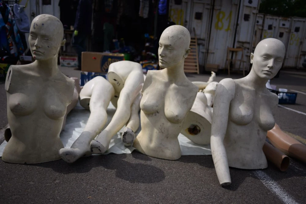 Mannequins on the floor of a flea market near Pochaina in Kyiv
