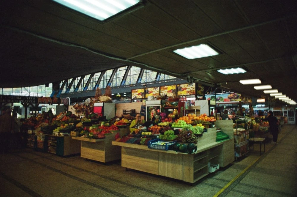 Food aisles with fruits and vegetables inside Zhytniy Market in Kyiv