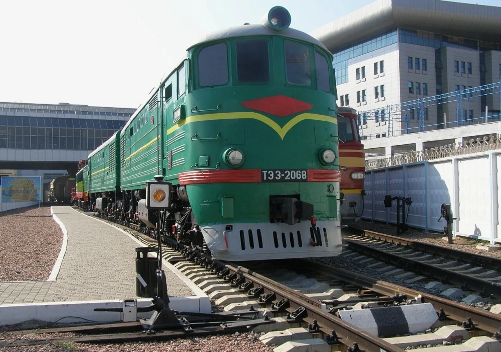 Railway Museum in Kyiv - massive green vintage diesel locomotive standing proudly on the tracks under the bright sun at the open-air museum