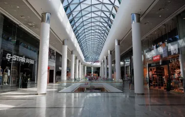 Ocean Plaza in Kyiv is a spacious hall with a high geometric glass roof filled with shops