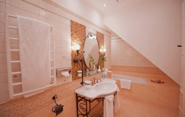 Opera Hotel - lavish marble bathroom with a large bathtub