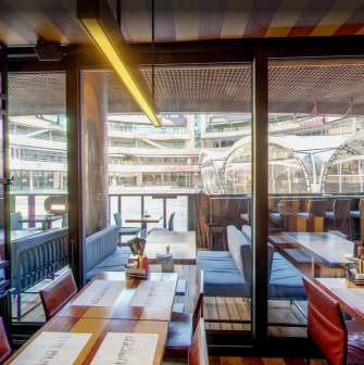 The Burger - wide dining area offering a stunning panoramic view through the large windows