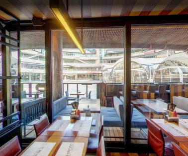 The Burger - wide dining area offering a stunning panoramic view through the large windows