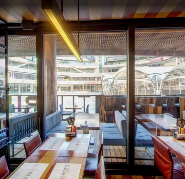 The Burger - wide dining area offering a stunning panoramic view through the large windows
