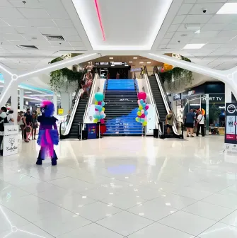 Gorodok Gallery in Kyiv - interior atrium view with escalators, bright lighting, and ice cream cone decorations