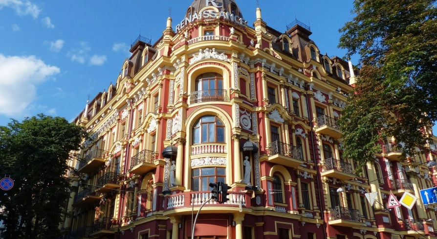 Syrotkin House - grand red and yellow corner house with ornate baroque decorations