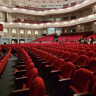 October Palace in Kyiv - empty auditorium with rows of red velvet seats