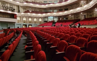 October Palace in Kyiv - empty auditorium with rows of red velvet seats