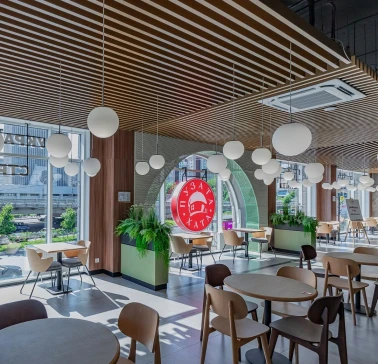 Restaurant Puzata Hata - bright dining area with large windows and the red Puzata Hata logo