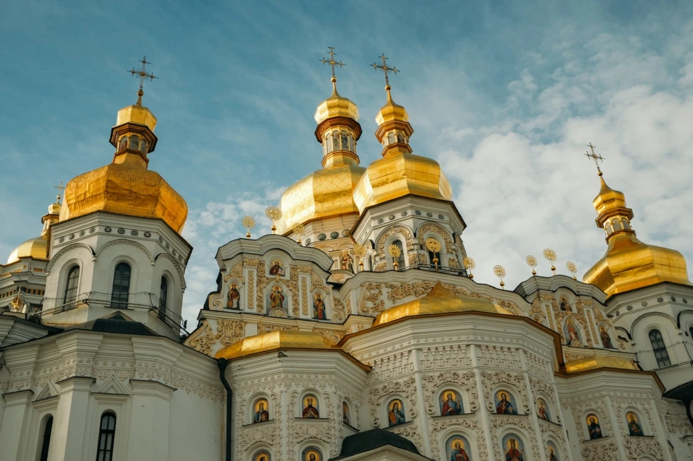 Kyiv Pechersk Lavra - Dormition Cathedral exterior with golden domes and ornate white facade