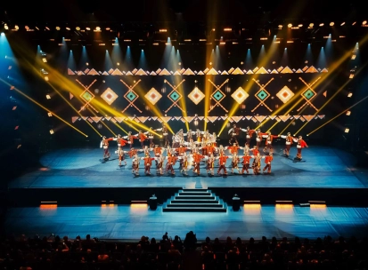 Palats Ukraina in Kyiv - vibrant stage performance by a folk dance ensemble in red costumes