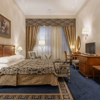 Room with a double bed at the Premier Palace Hotel in Kyiv, decorated in a classic style