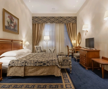 Room with a double bed at the Premier Palace Hotel in Kyiv, decorated in a classic style