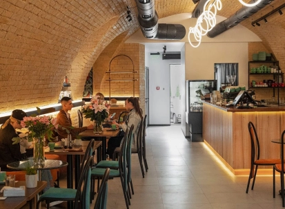 Idealist Coffee - dining area with small wooden tables