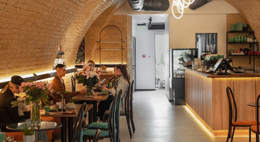 Idealist Coffee - dining area with small wooden tables