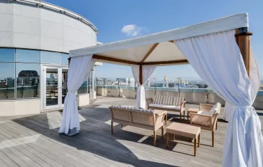 Hyatt Regency - rooftop terrace with elegant outdoor seating and city view