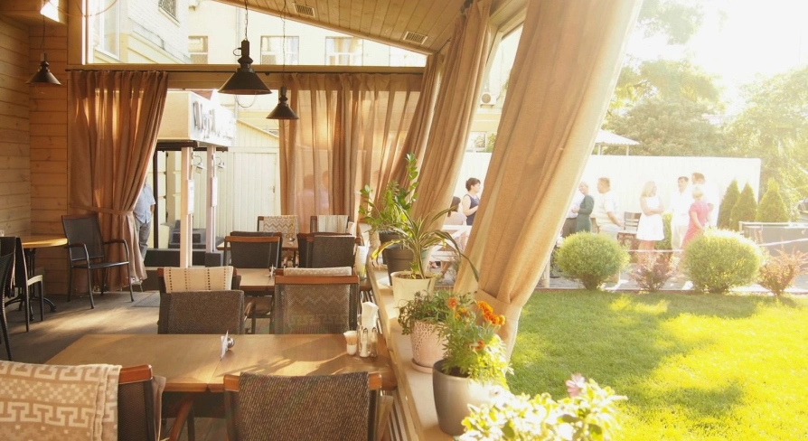 Restaurant Very Well Cafe - outdoor dining terrace featuring modern tables chairs and decorative plants