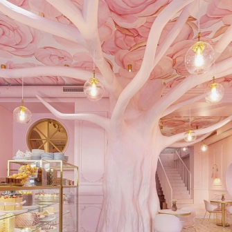 Interior of the Namelaka cafe in Kyiv with rosewood and a ceiling with petals